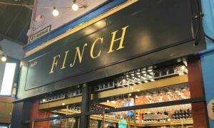 The exterior signage of Finch Wine Bar.