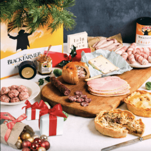 Gift hamper and its contents including quiche, cured meats, ham, cheese and pigs in blankets from The Black Farmer