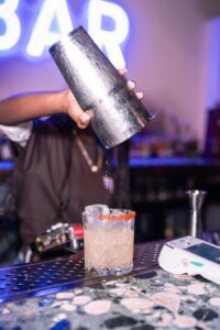 Pouring cocktail at Pergola