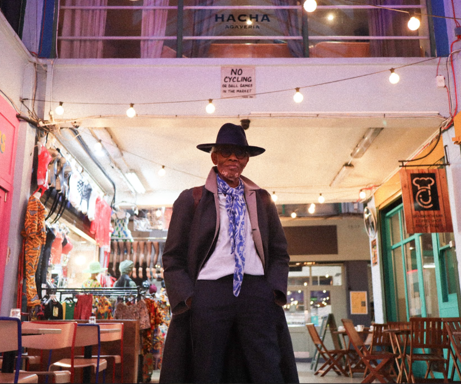 The Black Farmer standing in the centre of Market Row Brixton Village
