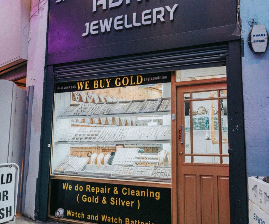The storefront of a jewellery store with a sign that reads 'Adam Jewellery'
