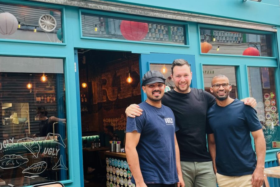 Team of three men standing outside the Ugly Dumpling restaurant